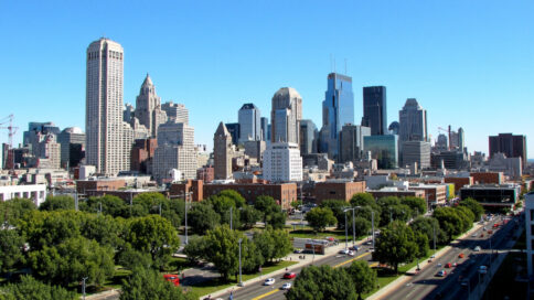 Modern mixed-use development in Texas cityscape with residential towers and retail spaces