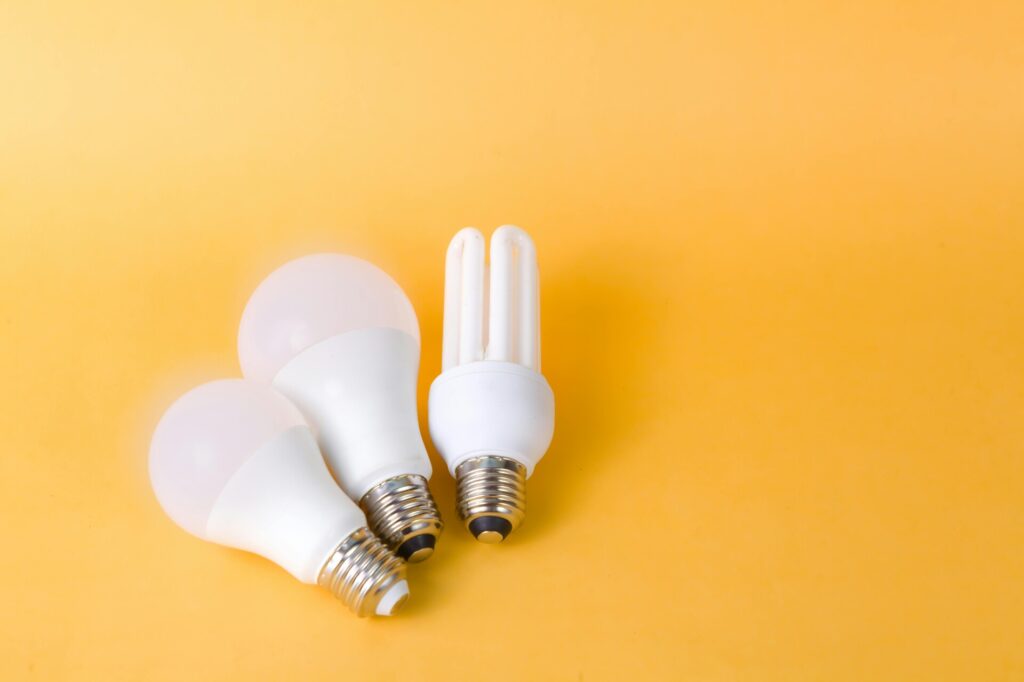 Three light bulbs on a yellow background.