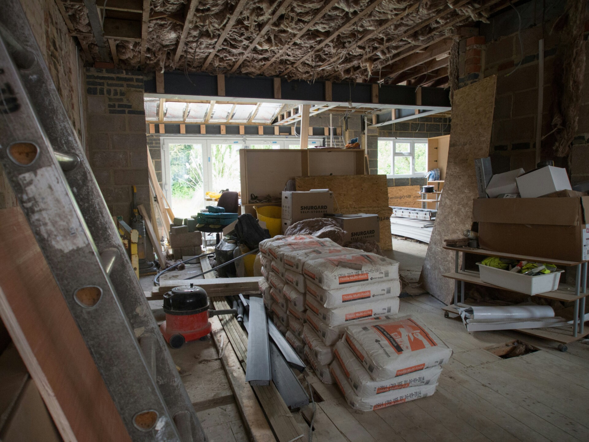 Construction Site Interior Interior of a construction site with materials and tools scattered around.
