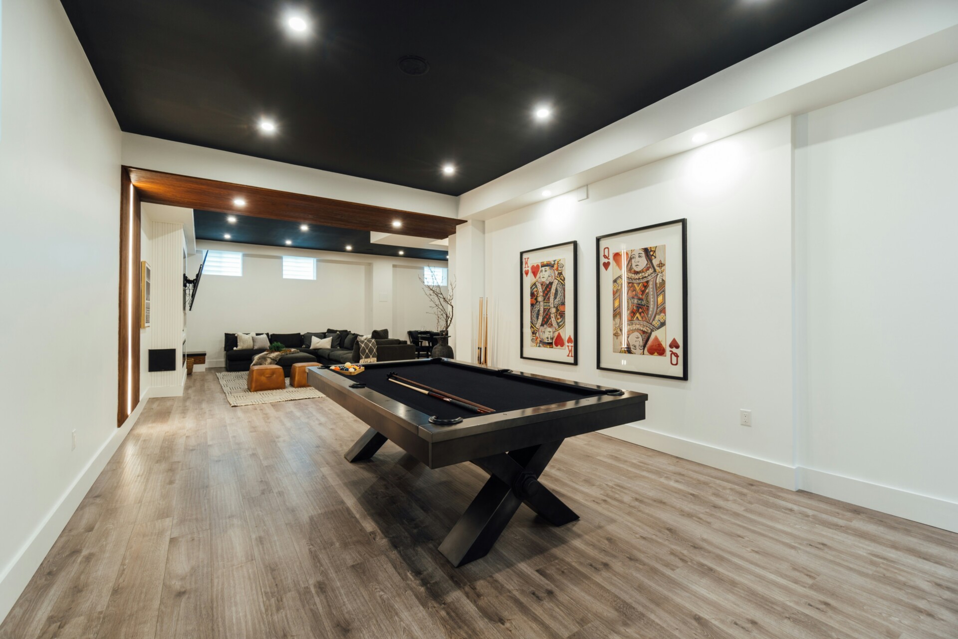 Stylish Game Room with Pool Table A modern game room featuring a pool table and stylish decor.