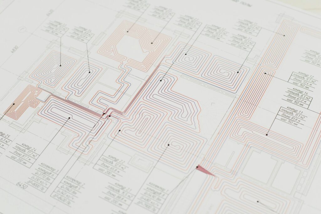 Detailed HVAC system diagram with complex blue and red line patterns.